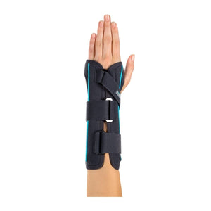 Hand with a black wrist support brace on a white background - okotoks hc pharmacy