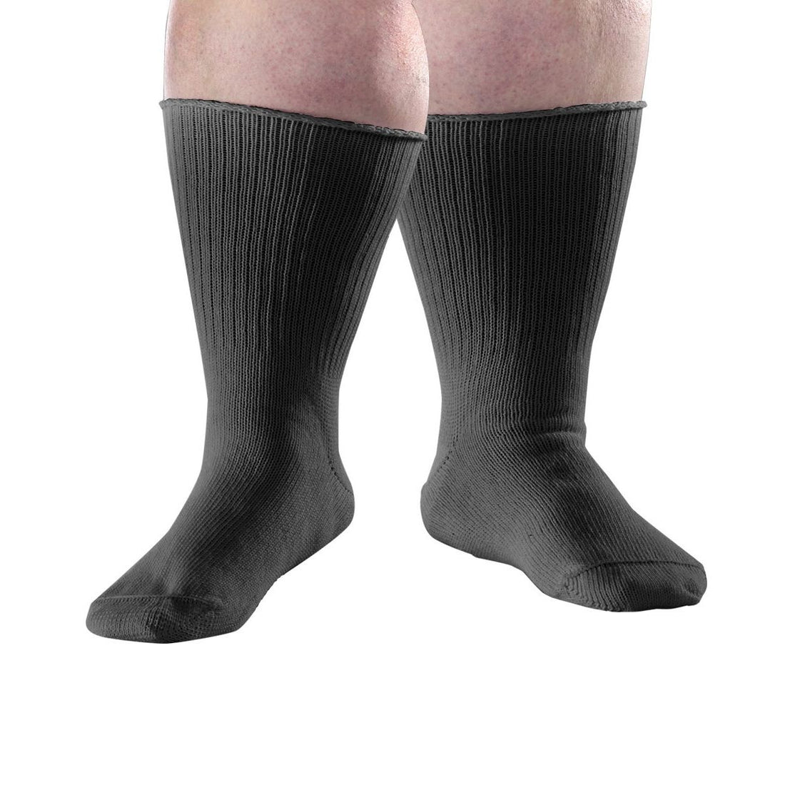 A pair of black ribbed crew socks worn on a person's legs, shown against a plain white background. - okotoks hc pharmacy