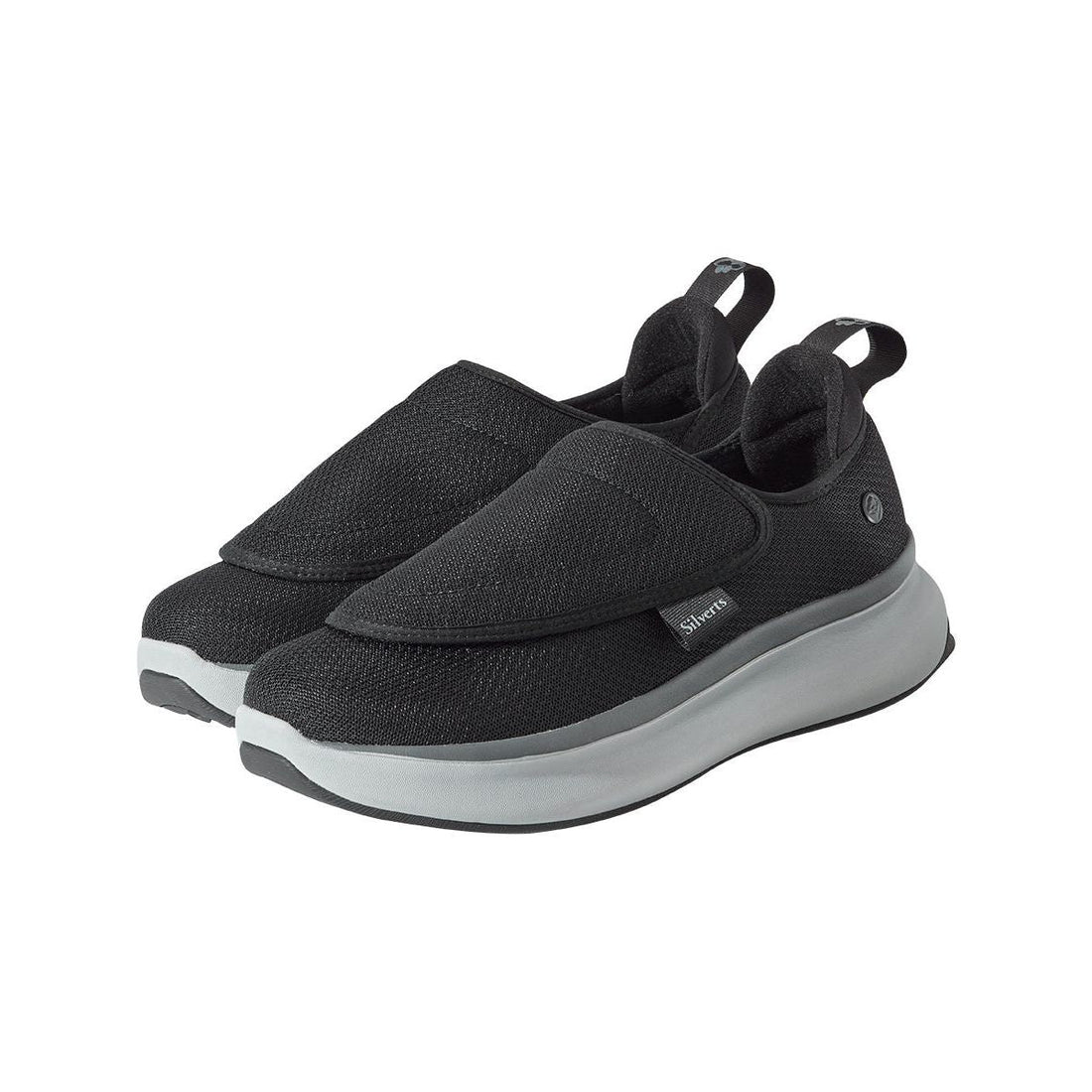 Black slip-on shoes with gray soles on a white background - okotoks hc pharmacy