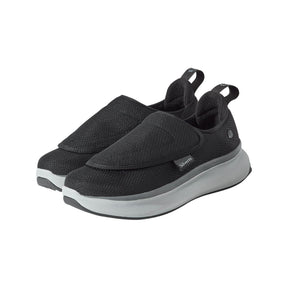 Black slip-on shoes with gray soles on a white background - okotoks hc pharmacy