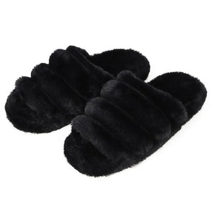 Pair of black fluffy slippers on a white background - okotoks hc pharmacy