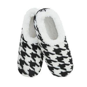 Pair of black and white houndstooth patterned slippers with white interior on a white background - okotoks hc pharmacy
