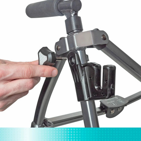 Hand adjusting a metal walker on a white background - okotoks hc pharmacy