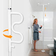 Woman using a white grab bar in a bathroom setting - okotoks hc pharmacy