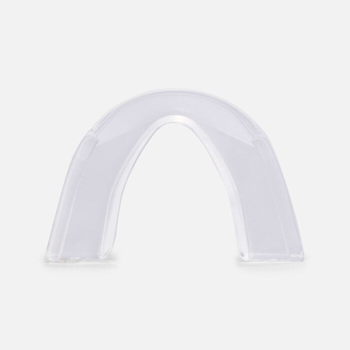A clear, semi-transparent arch-shaped mouthguard or dental tray shown on a plain light gray background. - okotoks hc pharmacy
