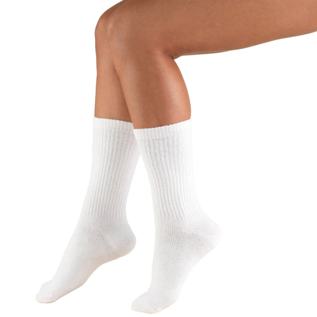 White socks worn by a person on a white background - okotoks hc pharmacy