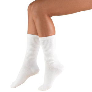 White socks worn by a person on a white background - okotoks hc pharmacy