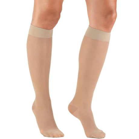 Beige knee-high socks worn by a person on a white background - okotoks hc pharmacy