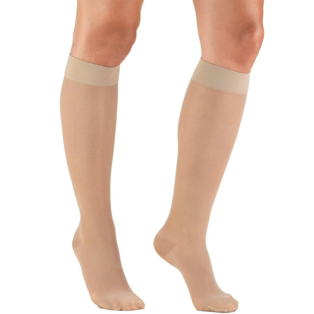 Beige knee-high socks worn by a person on a white background - okotoks hc pharmacy
