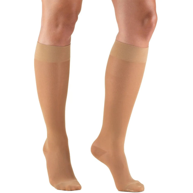 Beige knee-high socks worn by a person on a white background - okotoks hc pharmacy