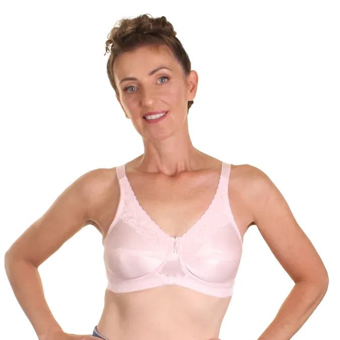 Woman wearing a pink bra on a white background - okotoks hc pharmacy