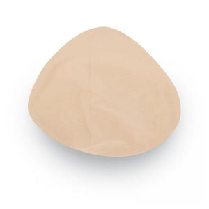A single beige silicone or latex breast implant cup shown from a top-down view on a white background. - okotoks hc pharmacy