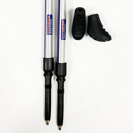 Two poles with black tips on a white background - okotoks hc pharmacy