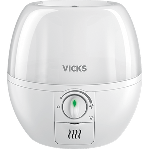A white Vicks humidifier with a rounded, dome-like top and a control dial on the front, shown against a plain white background. - okotoks hc pharmacy