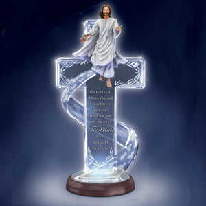 Decorative cross with Jesus on top against a dark blue background - okotoks hc pharmacy